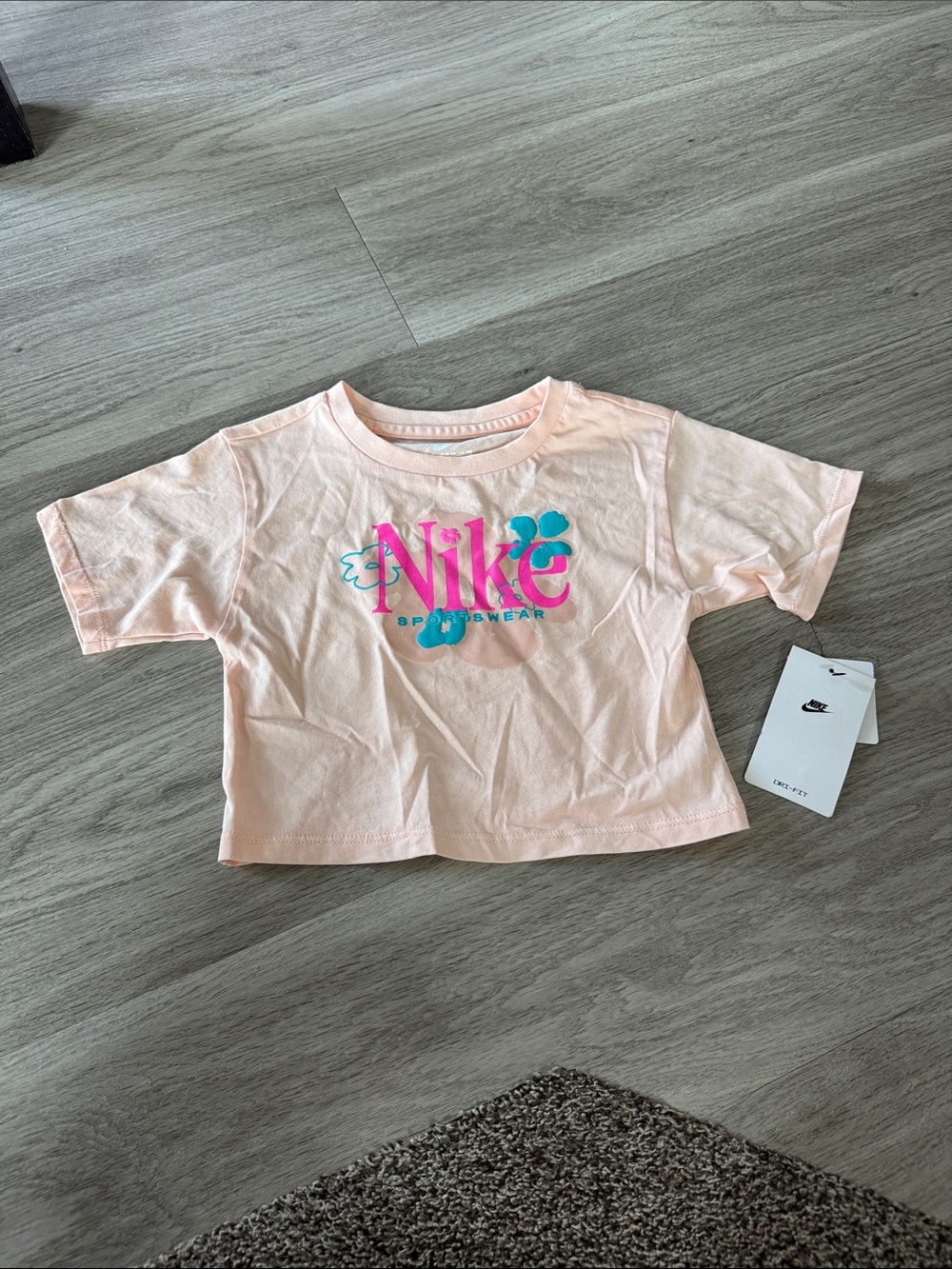 Nike Kids Light Pink Cropped Tee with Teal & Hot Pink Logo